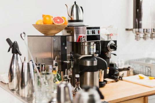 Kitchen appliances and dishes packed into moving boxes