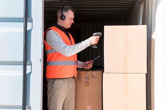 Business owner loading inventory into a mobile storage container