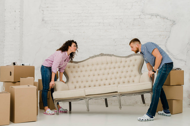 Furniture wrapped in protective blankets stored safely in a storage unit