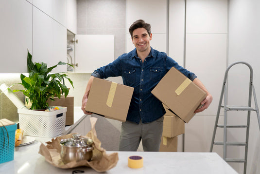 Pots and pans packed with paper padding into a moving box for a Southern California move