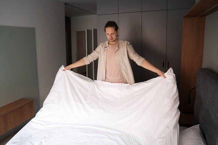 Clean mattress being prepared and wrapped for long-term storage