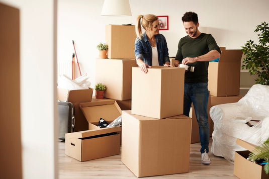 Couple packing cardboard boxes and wondering if moving expenses are tax deductible