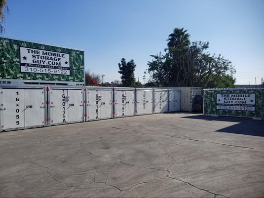 Waterproof steel storage containers with sealed doors sitting outdoors